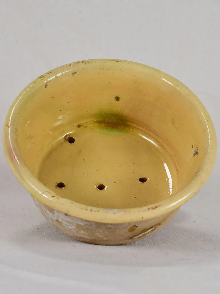 Antique French teracotta cheese strainer with yellow glaze