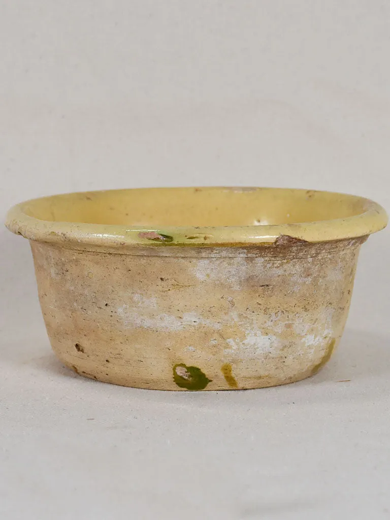 Antique French teracotta cheese strainer with yellow glaze