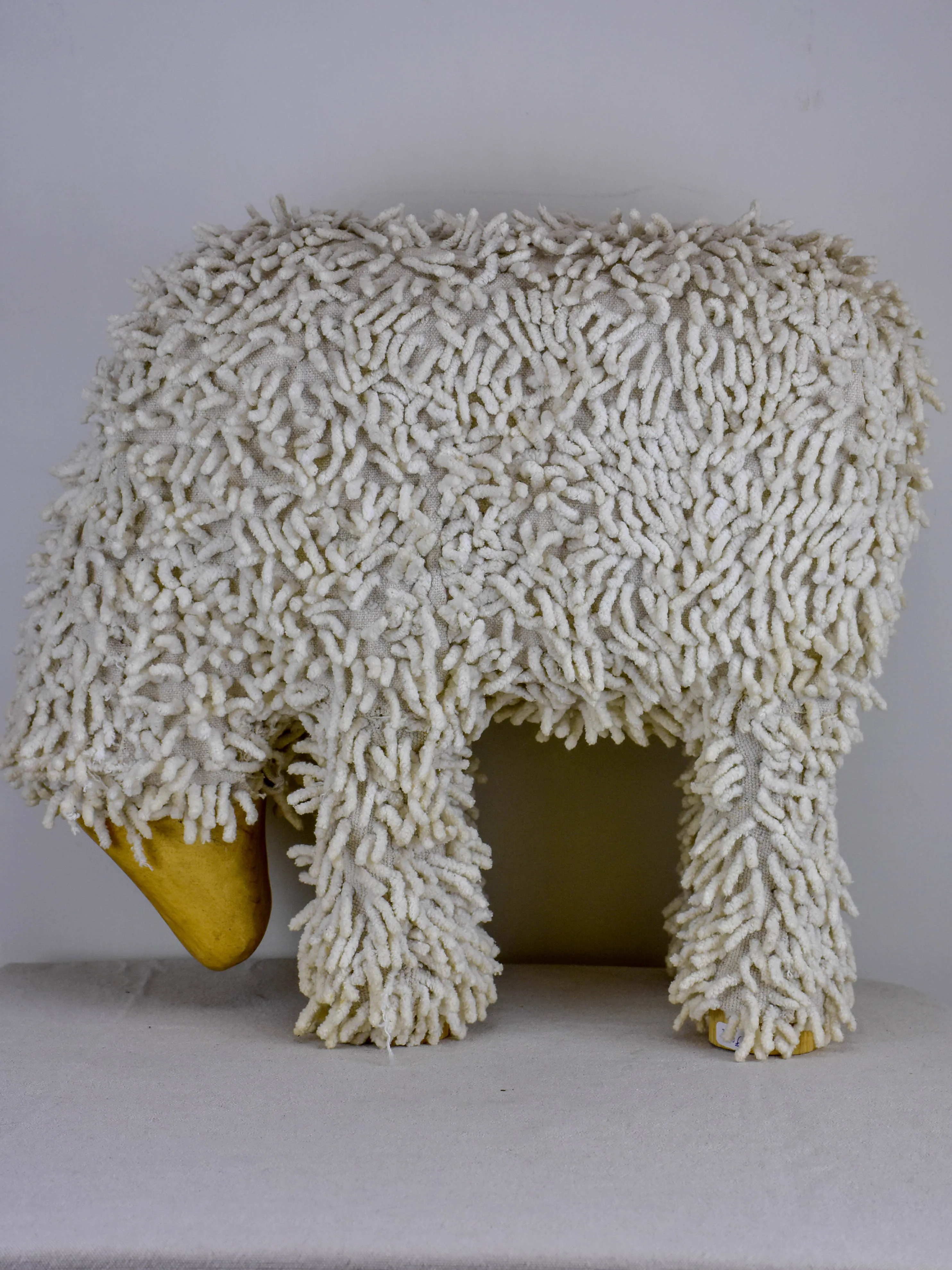 Vintage sculpture of a grazing sheep